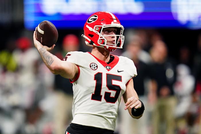 Dec 2, 2023; Atlanta, GA, USA; Georgia Bulldogs quarterback Carson Beck (15) throws a pass against the Alabama Crimson Tide in the third quarter of the SEC Championship at Mercedes-Benz Stadium. Mandatory Credit: John David Mercer-USA TODAY Sports